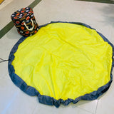 Toy storage bag with foldable playing Mat